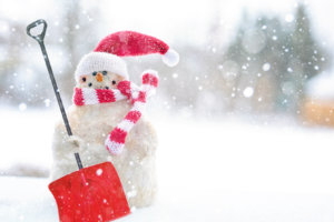 snowman holding a snow shovel